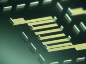 A unique thing film Redistribution Layer (RDL) creates custom circuits on a glass substrate.